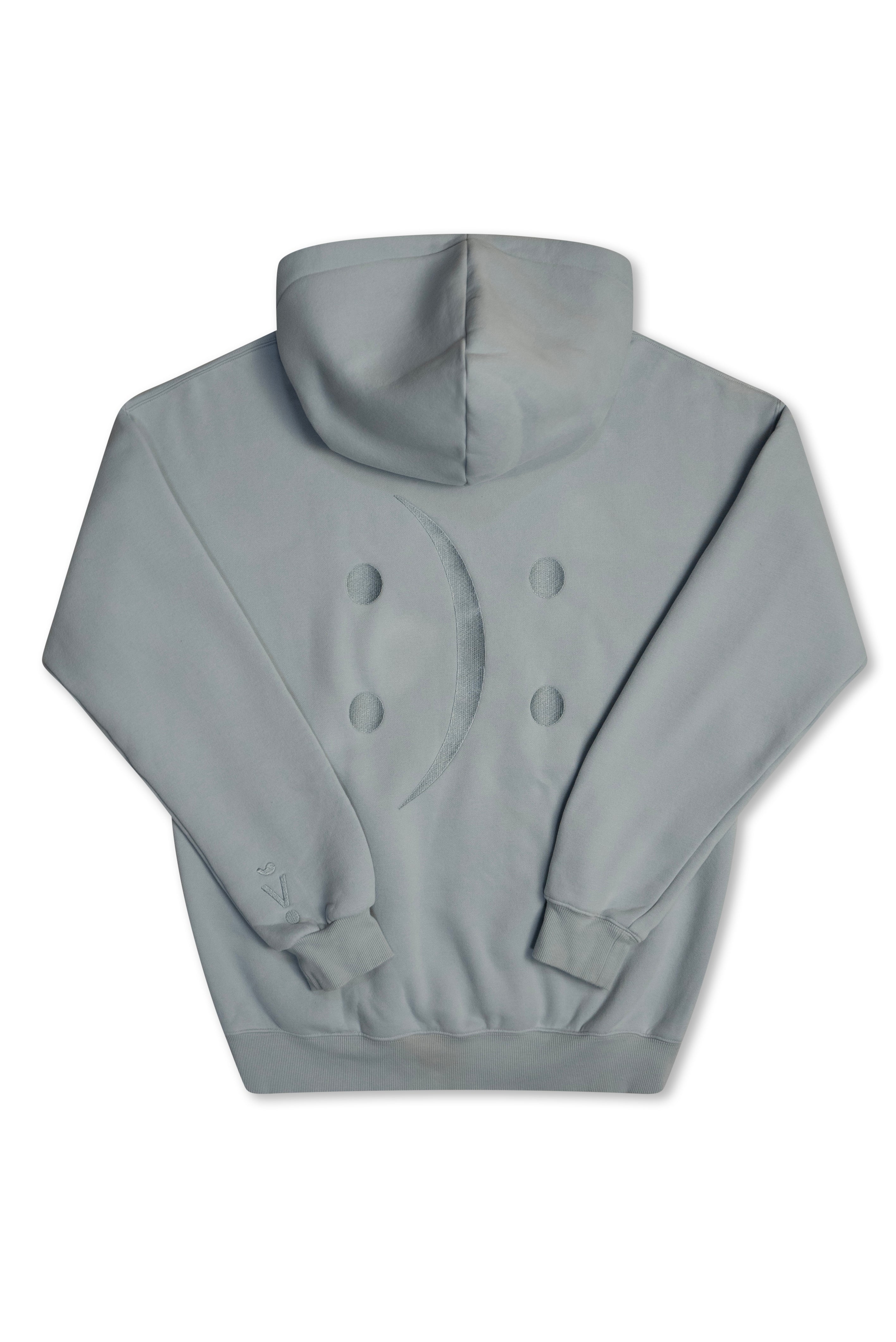 A light gray hooded sweatshirt shown from the back, featuring a double-breasted button design on the back and ribbed cuffs and hem, displayed on a clean white background.
