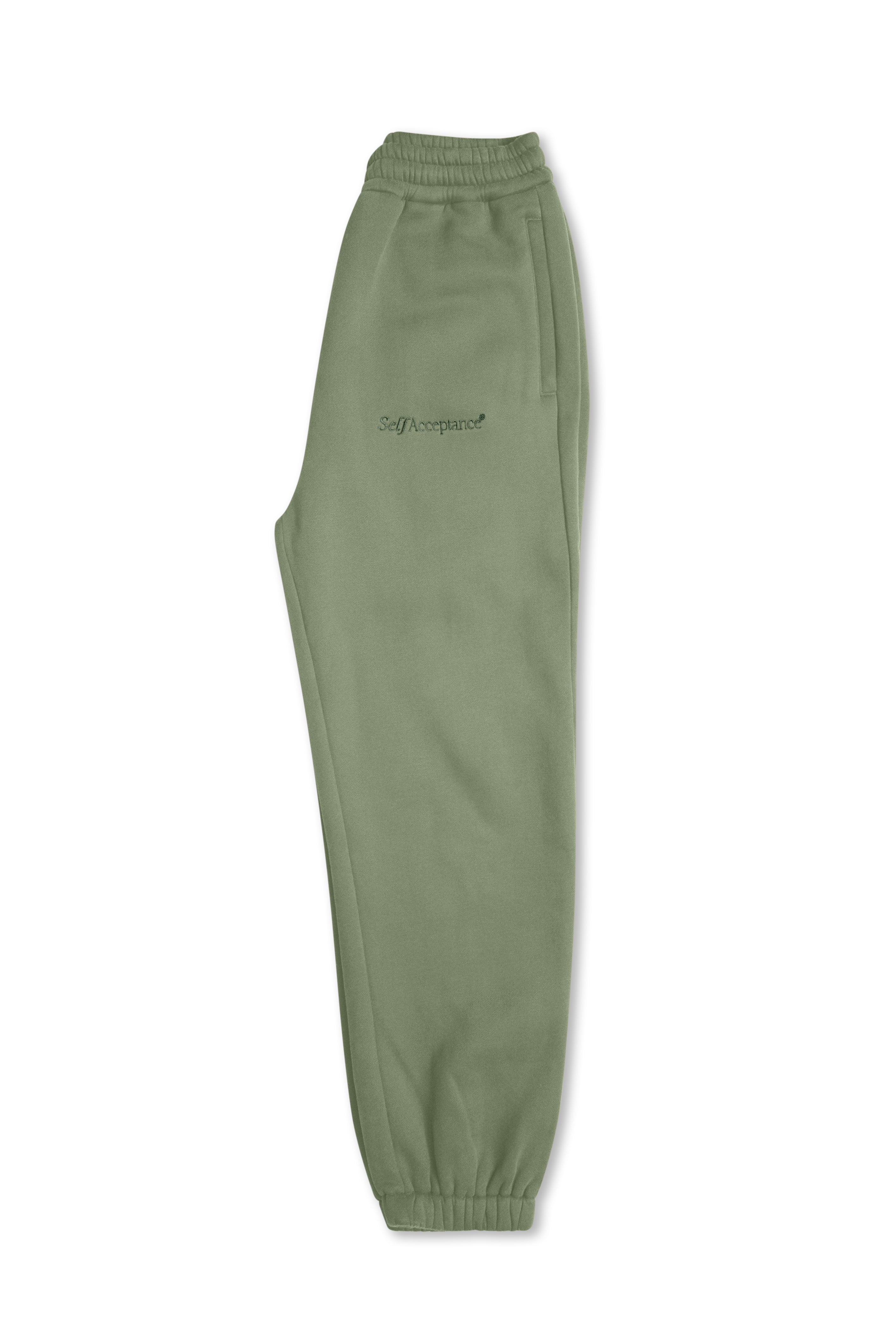 Light green sweatpants with an elastic waistband and cuffs, featuring a small black embroidered script logo on the left thigh, shown against a plain white background.